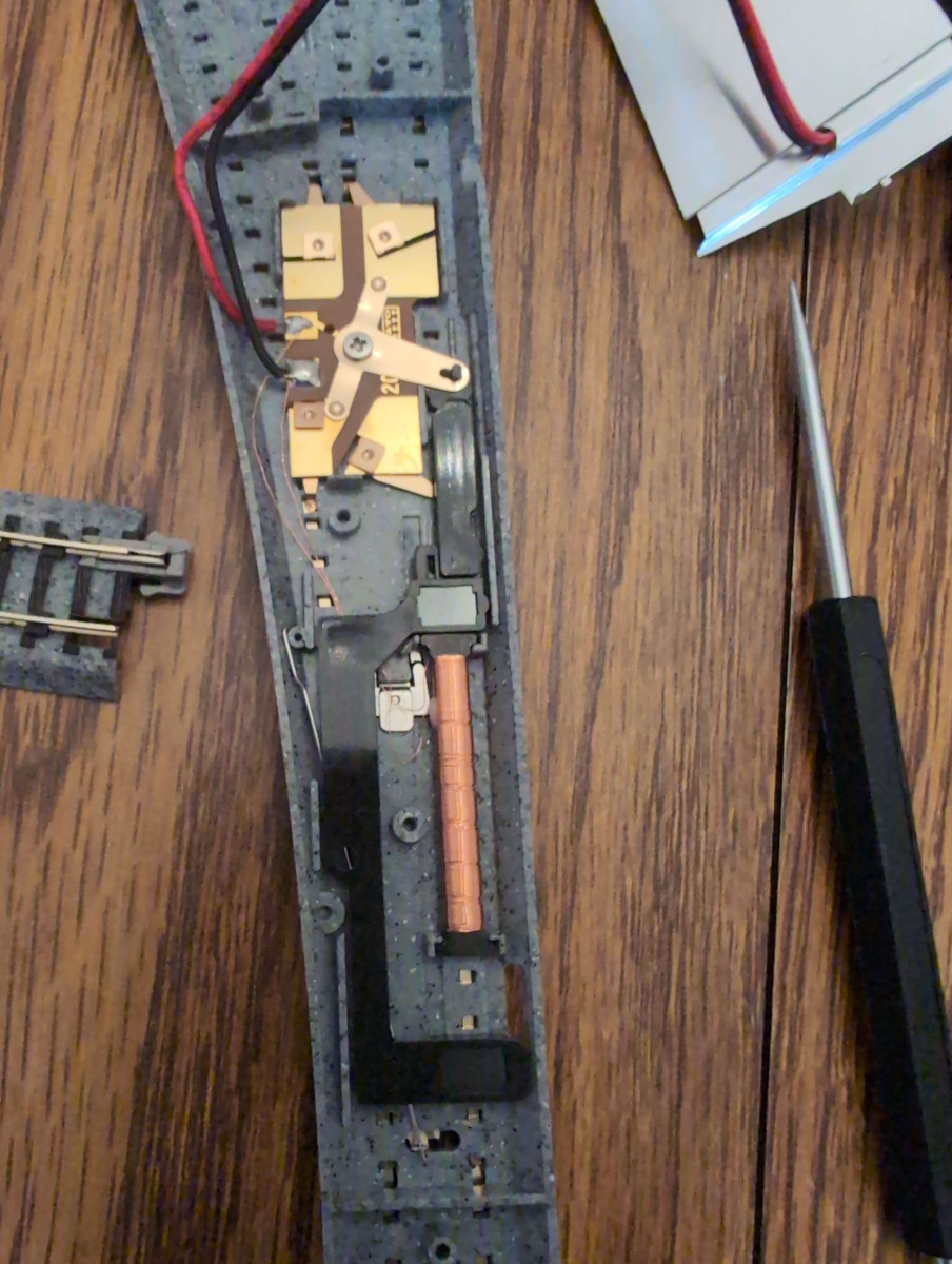 A Kato turnout with its back panel open